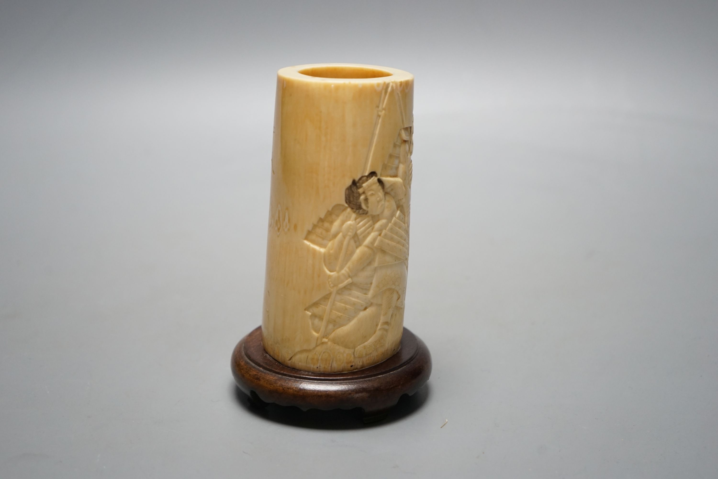 A Japanese Meiji period brush pot with samurai, 23 cms high including stand.